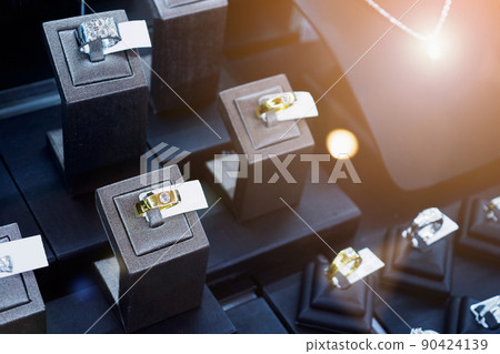 Diamond rings in jewelry luxury store window display 90424139