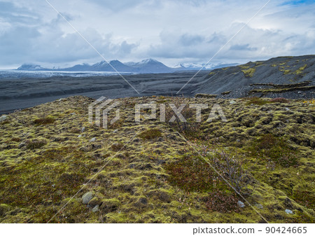 Iceland autumn tundra landscape near Haoldukvisl glacier, Iceland. Glacier tongue slides from the Vatnajokull icecap or Vatna Glacier near subglacial Esjufjoll volcano. Not far from Iceland Ring Road. Iceland autumn tundra landscape near Haoldukvisl glacier, Iceland. Glacier tongue slides from the Vatnajokull icecap or Vatna Glacier near subglacial Esjufjoll volcano. Not far from Iceland Ring Road. 90424665