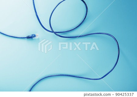 Blue Ethernet Cable Cord Patch cord on a blue background with free space 90425337