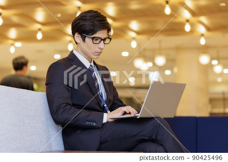 A man working on a computer 90425496