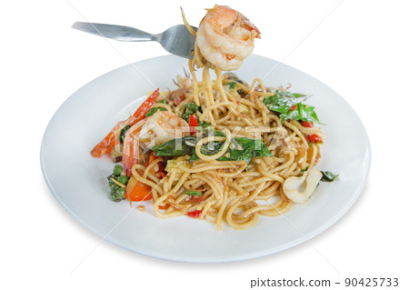 Top view of Spaghetti with spicy prawn and squid, focus selective Top view of Spaghetti with spicy prawn and squid, focus selective 90425733