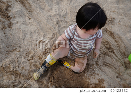 Playing with sand Playing with sand 90428582