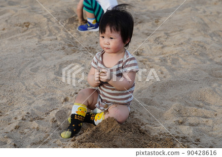 Playing with sand Playing with sand 90428616