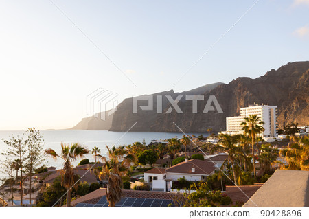 Landscape with cliff and houses near ocean. Landscape with cliff and houses near ocean. 90428896