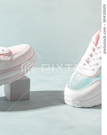 White pastel sneakers with sequins on geometric podiums on turquoise White pastel sneakers with sequins on geometric podiums on turquoise 90430009