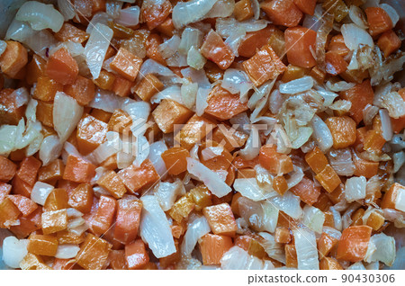 Full frame of fried onion slices and carrots. A mixture of vegetables sauteed in oil. Healthy Eating. Food, ingredients. Full frame of fried onion slices and carrots. A mixture of vegetables sauteed in oil. Healthy Eating. Food, ingredients. 90430306