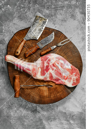 Top view of raw lamb shoulder chump on butcher's cutting log Top view of raw lamb shoulder chump on butcher's cutting log 90430735