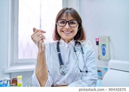 Headshot of female doctor talking to webcam, make online video call 90430870