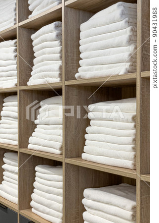The bathroom towel  on the shelves in the closet 90431988