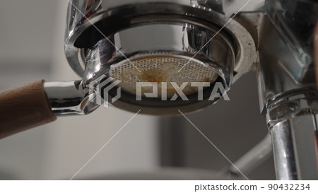 pour espresso with bottomless portafilter closeup pour espresso with bottomless portafilter closeup 90432234