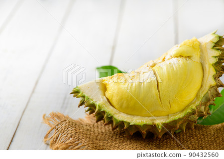 Durian and durian peels  (monthong) on sack and old wood background, 90432560