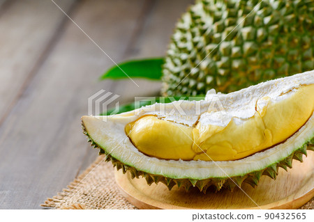 Puangmanee durian on wood plate and wood background, Puangmanee durian on wood plate and wood background, 90432565