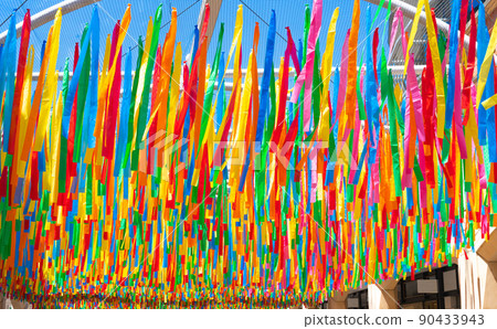 multi-colored textile ribbons background 90433943