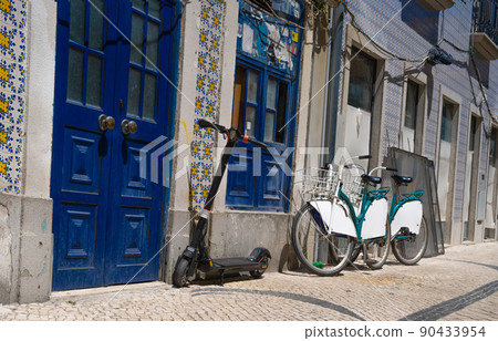 typical portugal old street with blue doors 90433954