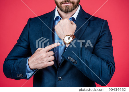 guy pointing finger on watch. business fashion style accessory. time is success. guy pointing finger on watch. business fashion style accessory. time is success. 90434662