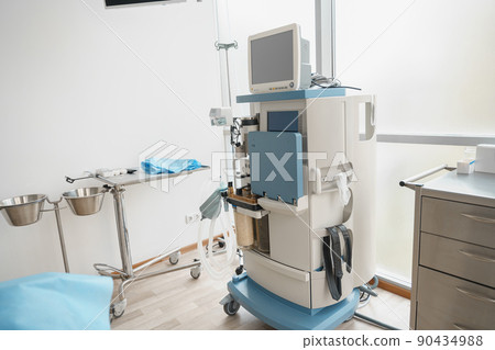 Interior of operation room with different medical equipment ready for surgery Interior of operation room with different medical equipment ready for surgery 90434988