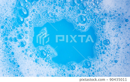 Detergent foam bubble, blue background. 90435011