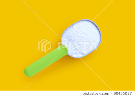 Baking soda on yellow background. Baking soda on yellow background. 90435057
