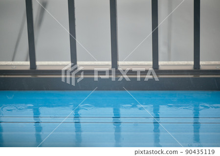 Image of rainy season on the balcony of a house wet with rain Image of rainy season on the balcony of a house wet with rain 90435119