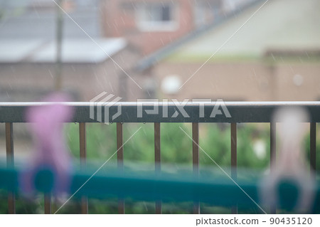 Image of rainy season on the balcony of a house wet with rain Image of rainy season on the balcony of a house wet with rain 90435120