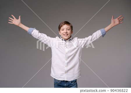 Young man screaming with happiness, celebrating triumph and victory, clenching Young man screaming with happiness, celebrating triumph and victory, clenching 90436822