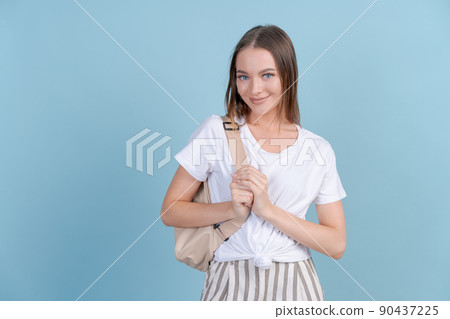 Positive college student girl holding backpack on her back Demonstrating Positive college student girl holding backpack on her back Demonstrating 90437225