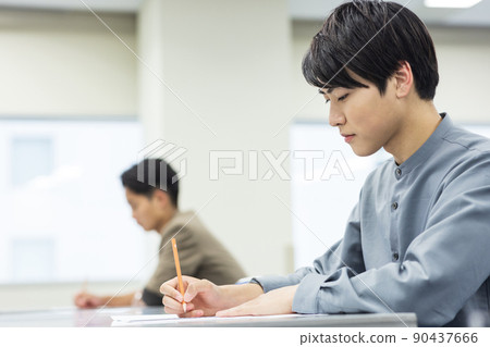 Young man taking class 90437666