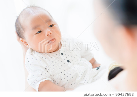 Parent-child contact, baby communication with a tongue sticking out 90437698