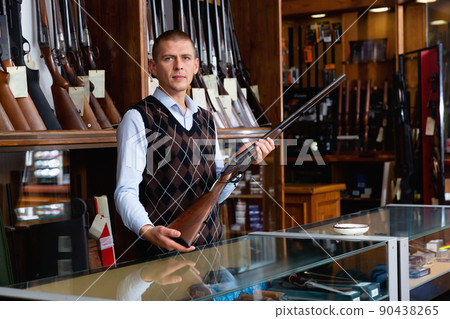 Owner of armory shop offering vintage hunting rifle 90438265