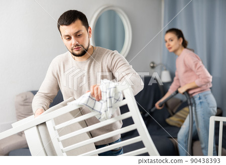 Wife and husband cleaning up in apartment Wife and husband cleaning up in apartment 90438393
