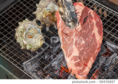 Turban shell and beef grilled over charcoal Turban shell and beef grilled over charcoal 90439887