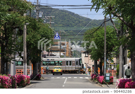 223 series train running in Ashiya city 90440286