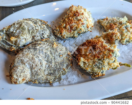 Platter of Oysters Rockefeller on rock salt 90441682