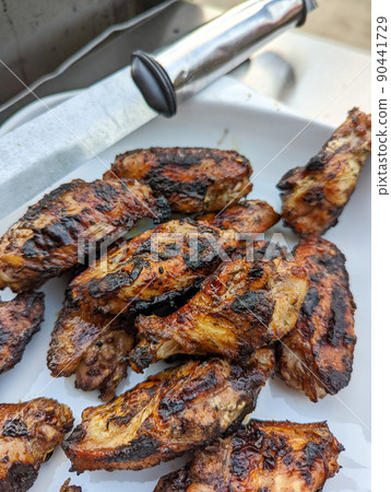 bourbon and brown sugar marinated wings in blackened seasoning 90441729