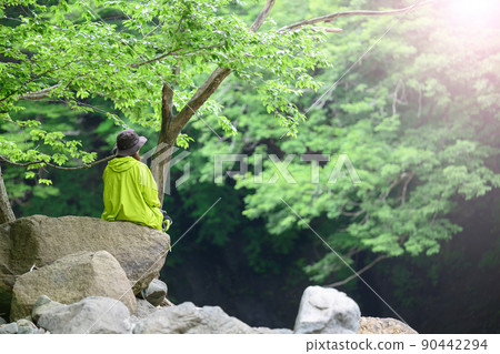 People taking a break after climbing 90442294