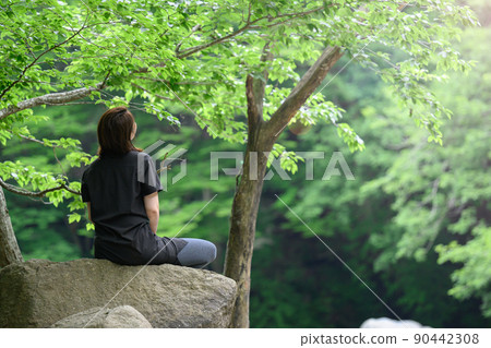 People taking a break after climbing 90442308