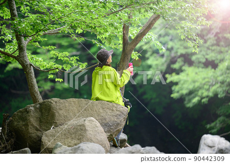 People taking a break after climbing Drink water People taking a break after climbing Drink water 90442309