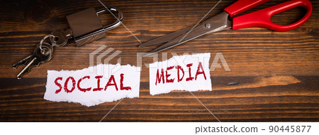 Social Media Business concept. Scissors and padlock on a wooden background Social Media Business concept. Scissors and padlock on a wooden background 90445877