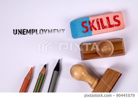 UNEMPLOYMENT and SKILLS concept. Office supplies on a white background UNEMPLOYMENT and SKILLS concept. Office supplies on a white background 90445879