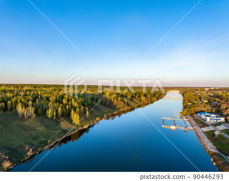 Beauriful sunset view along the Iset river and rocks in town Kamensk-Uralskiy. A scenic sunset at the river. Kamensk-Uralskiy, Sverdlovsk region, Ural mountains, Russia. Aerial view 90446293