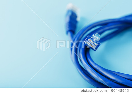 Blue UTP Internet Cable Isolated on a blue background Ethernet Cord 90448943