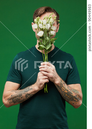 Shy Man with Flowers on Vibrant Green 90449983