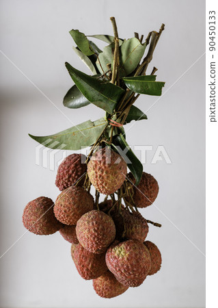 bunch of lychees on a white background 90450133