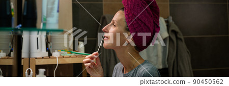 Young woman taking nasal sample with a cotton swab stick for coronavirus 90450562
