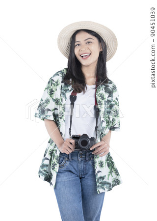 Asian woman with hat and camera standing 90451039