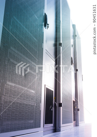 Data center with a row of server racks 90451631