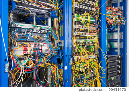 Server rack with fiber optic cables attached to front panel switch ports 90451670