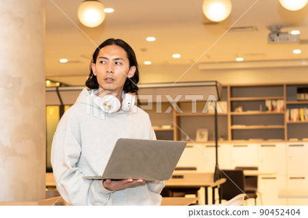 Men in headphones with a laptop 90452404