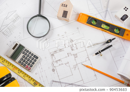 Top view of house plan blueprint paper with repair tools on table desk at architecture office 90453683