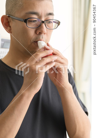 Men using asthma inhalers Men using asthma inhalers 90454367